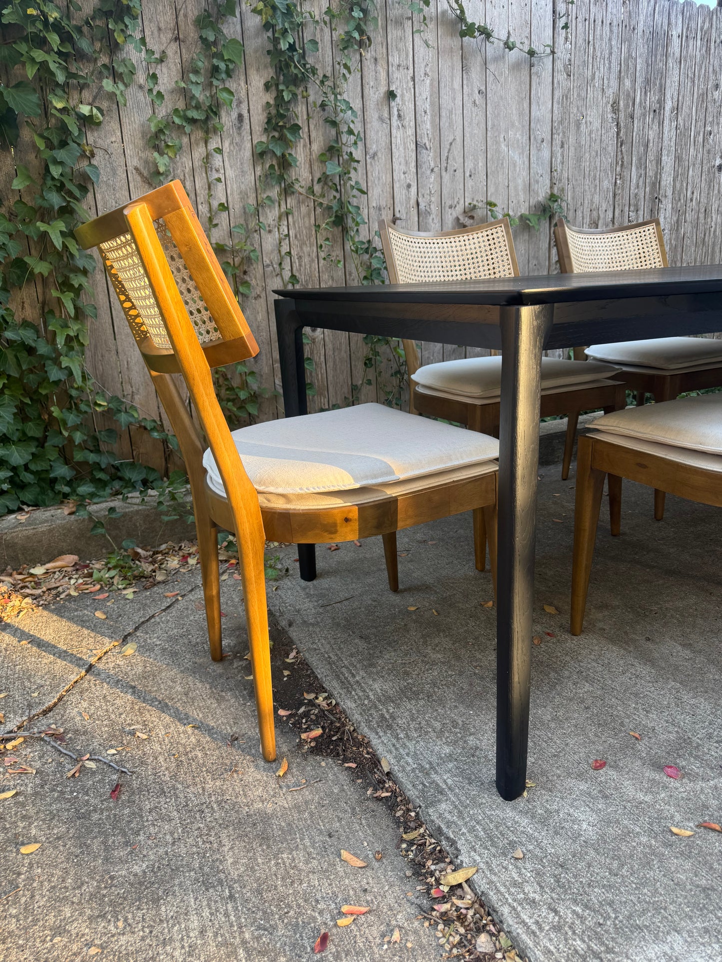 Perigold Dining Set with Black Ethnicraft Bok Oak Table 79” + Four Hands Britt Chairs Set of Six Light Wood with Cane